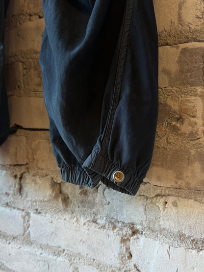 Women's Freecity Airjump Pant in large matte satin fabric featuring flap and snap details, with moonshroom pattern.