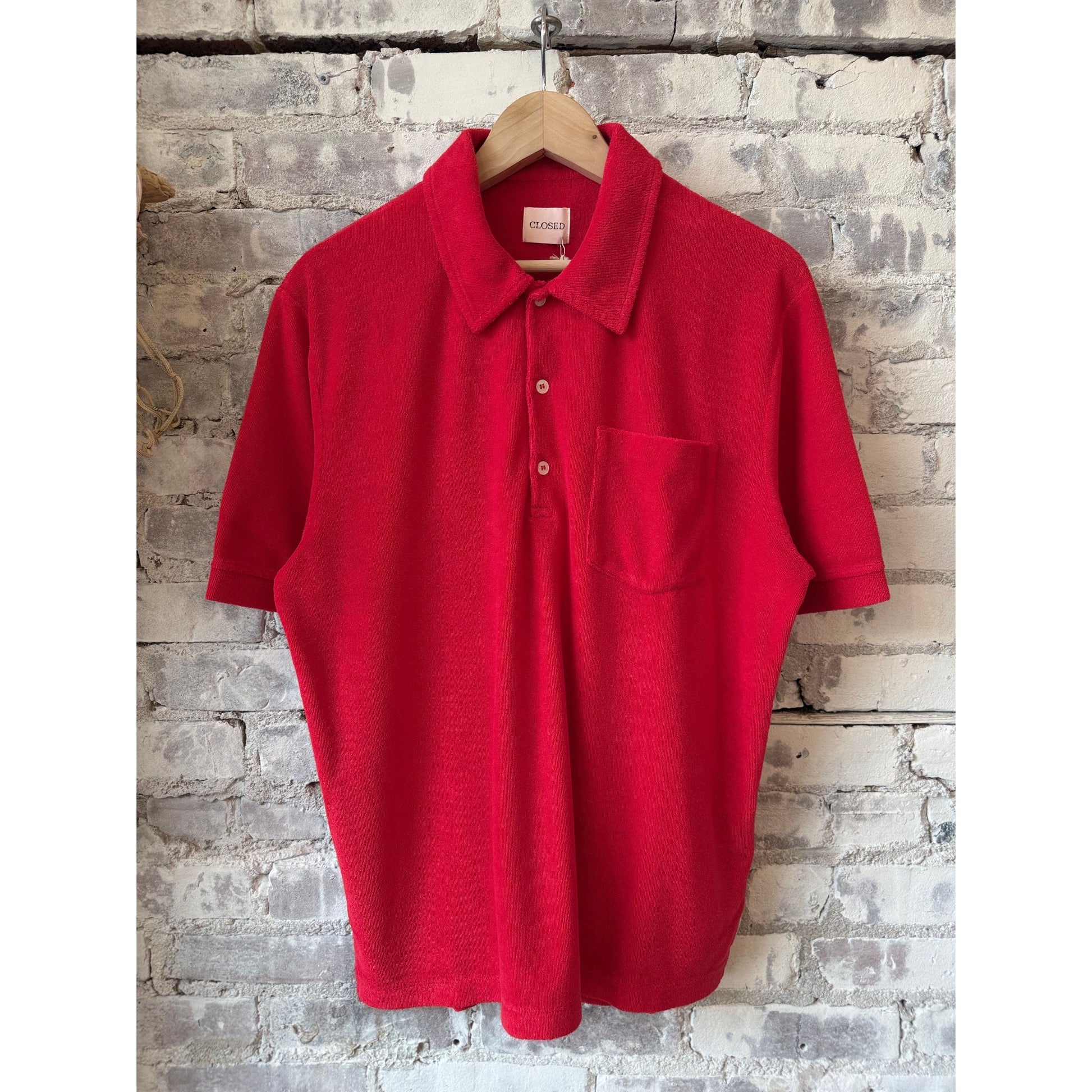 Men's short sleeve polo shirt in laser red by Closed Men's, featuring a classic collar and button placket.