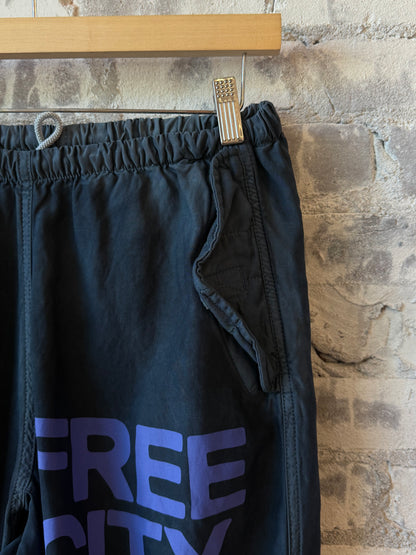 Women's Freecity Airjump pants in matte satin fabric with flap and snap details, featuring Moonshrooms design.