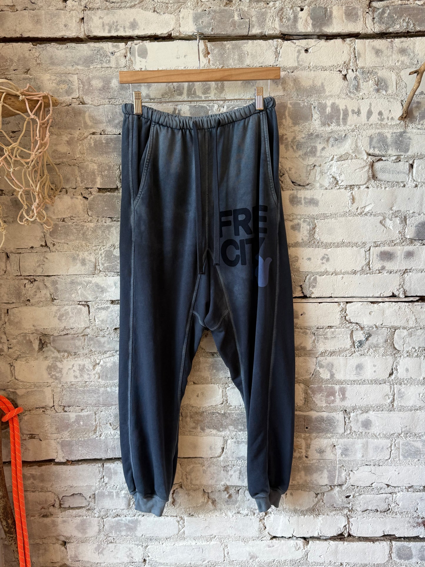 Women's Freecity large Sunfades Pocket Sweatpant with Moonshrooms print, featuring relaxed fit and side pockets.