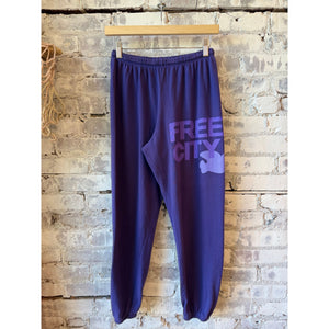 Women's Freecity large purple sweatpants with a floral bush print, casual fit, and comfortable waistband.