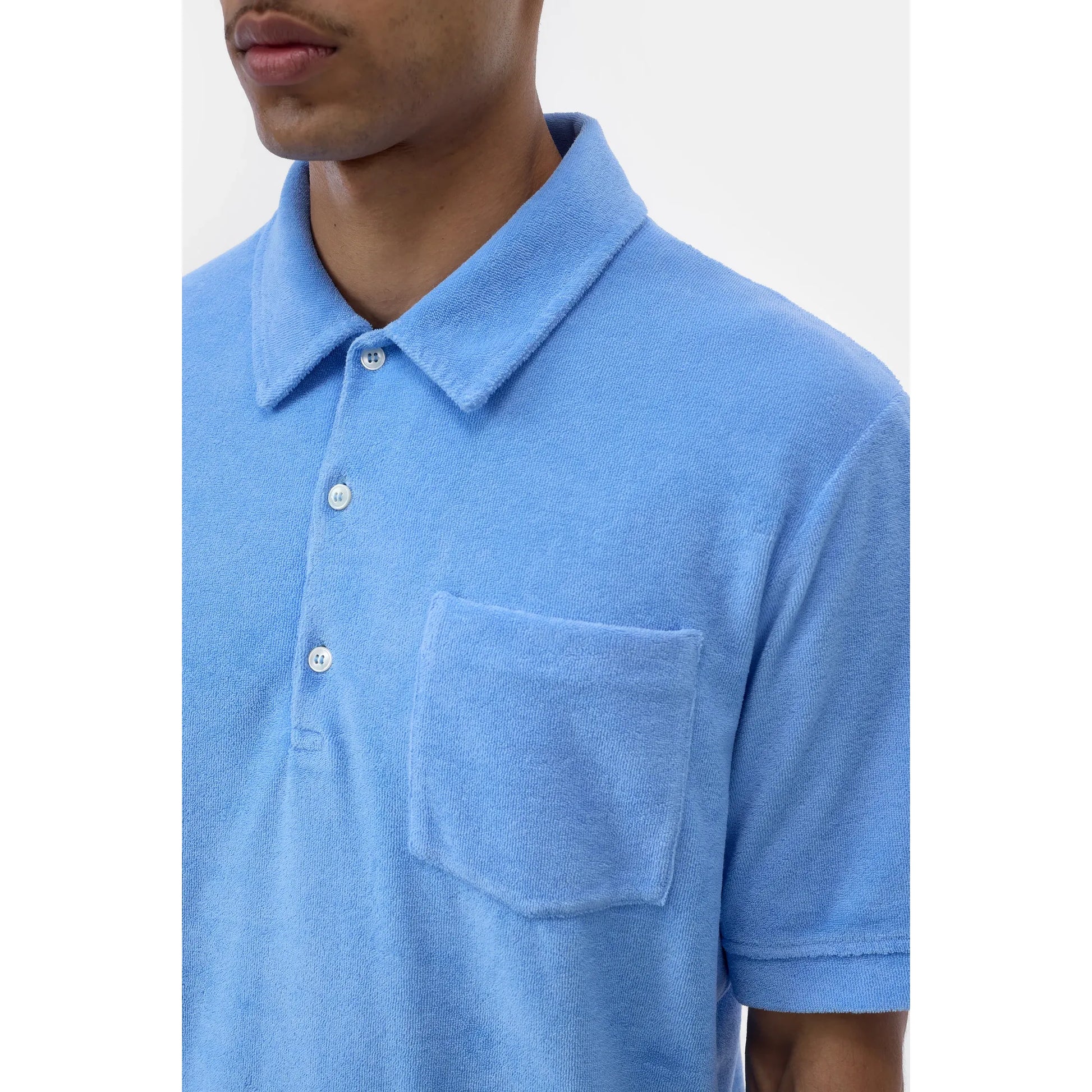 Men's sky blue short sleeve polo shirt by Closed Men's, shown flat with collar and buttons, casual and comfortable style.