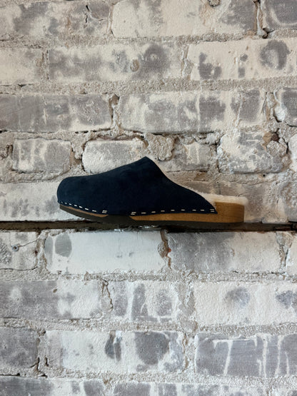 Women's Ella suede and lambswool navy and white clog by Kunsten Clogs, featuring a stylish slip-on design with a textured sole.