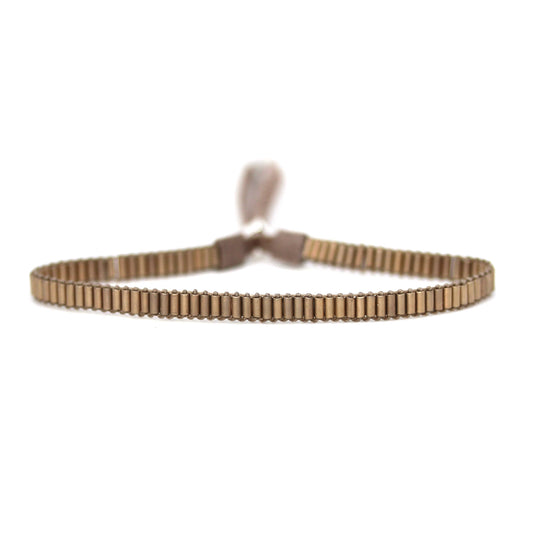 Julie Rofman matte gold mini bracelet, a stylish accessories piece featuring a sleek gold finish and delicate design.