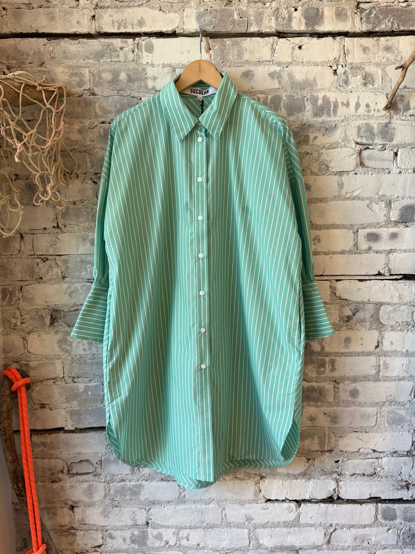 Women's Secular Kelly Shirt Dress in turquoise and white stripe, featuring a relaxed fit and button-front design.