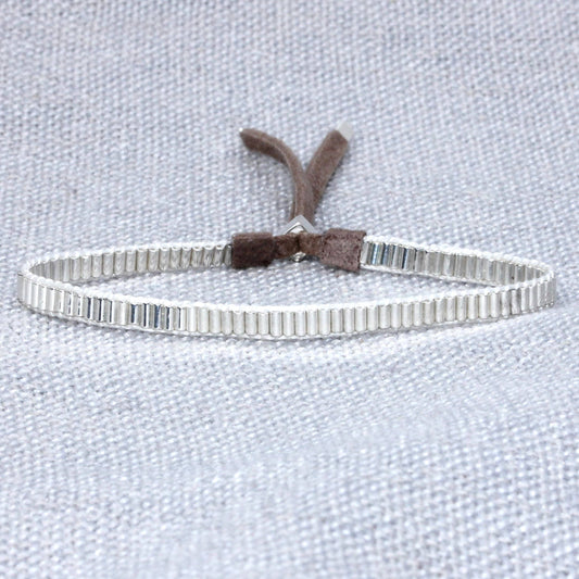 Silver mini bracelet by Julie Rofman, delicate jewelry accessory with fine chain and subtle design.