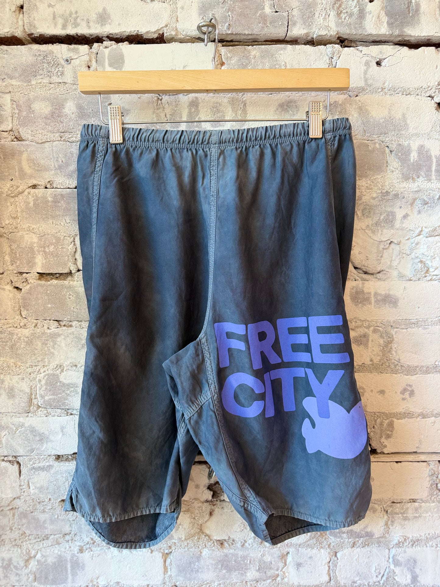 Women's Freecity matte satin back pocket shorts in Moonshrooms Powder color, featuring a relaxed fit and stylish design.
