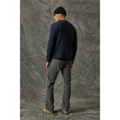 Men's black 5-pocket cord jean by Save Khaki United, showing classic fit and durable fabric with five front and back pockets.