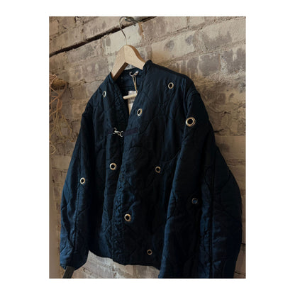 Women's navy military liner grommets by Sloppy Seconds, featuring durable metal eyelets on a navy fabric liner.
