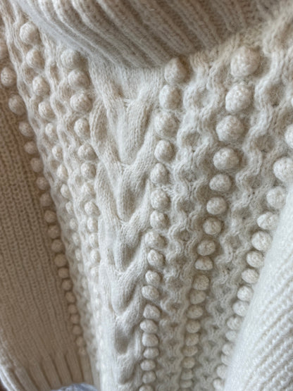 Women's ivory Lyla sweater by ELEVEN SIX displayed on a hanger with soft fabric texture and stylish fit.