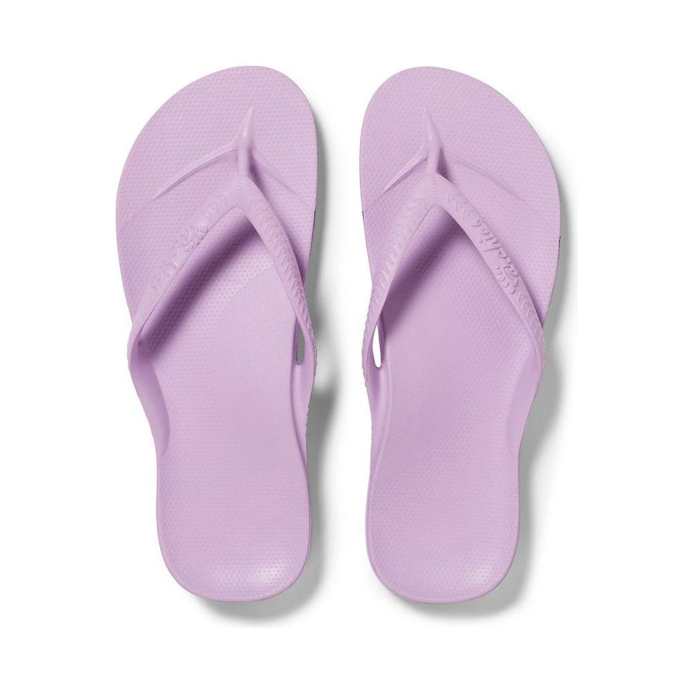 Archies M5/W6 footwear showing stylish design with comfortable fit, featuring sleek black shoes with subtle detailing.