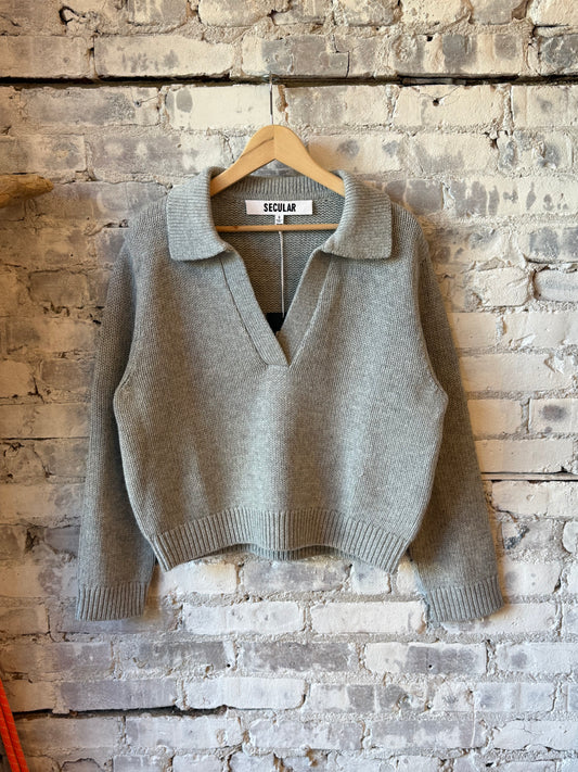 Women's grey long sleeve Henley sweater by Secular, featuring a cozy knit design and buttoned placket.