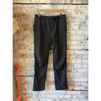 Men's black fade off-trail windpant by Relwen, showing the lightweight fabric and relaxed fit suitable for outdoor activities.