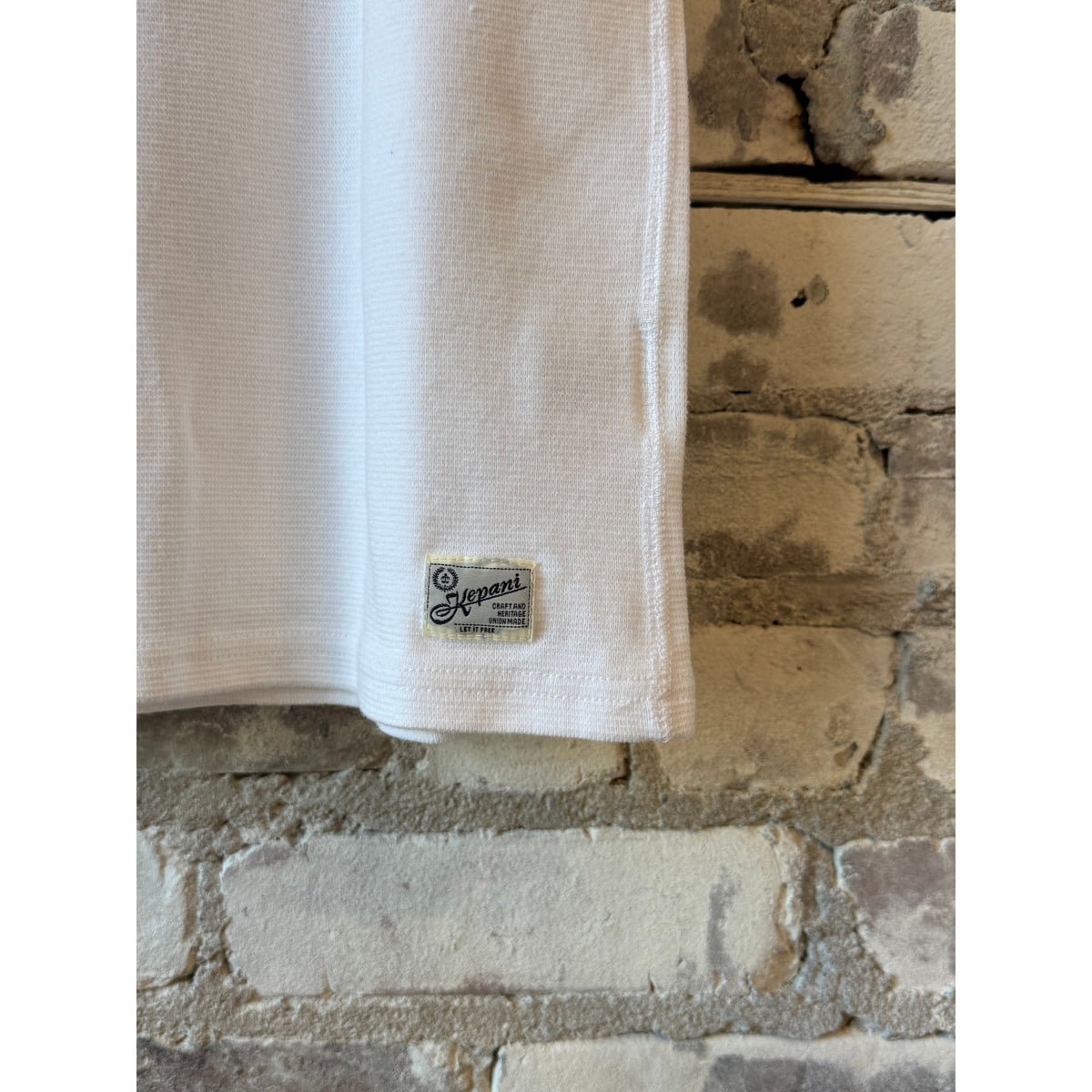 Kepani Raffy men's white crew neck SS sweatshirt, casual style, soft fabric, shown on a model.