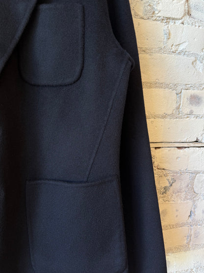 Hartford Men's Jojo Woven Jacket in navy, featuring a textured woven fabric and classic collar, displayed on a hanger.