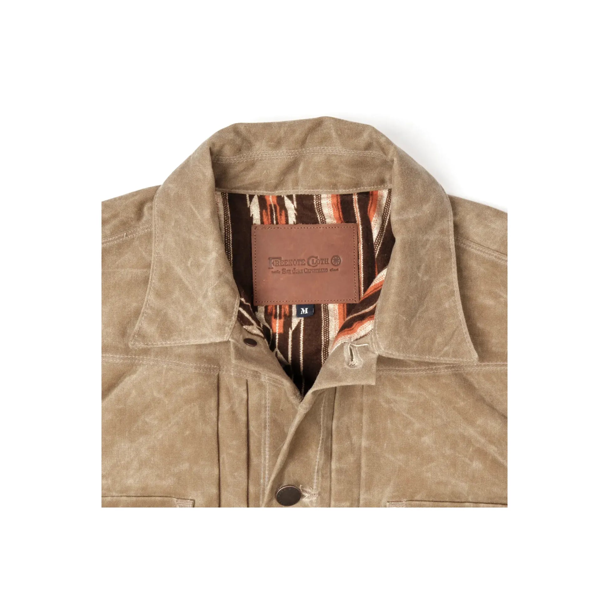 Men's waxed canvas Riders Jacket in Tobacco Brown by Freenote Cloth, showing the rugged, textured exterior and classic design.