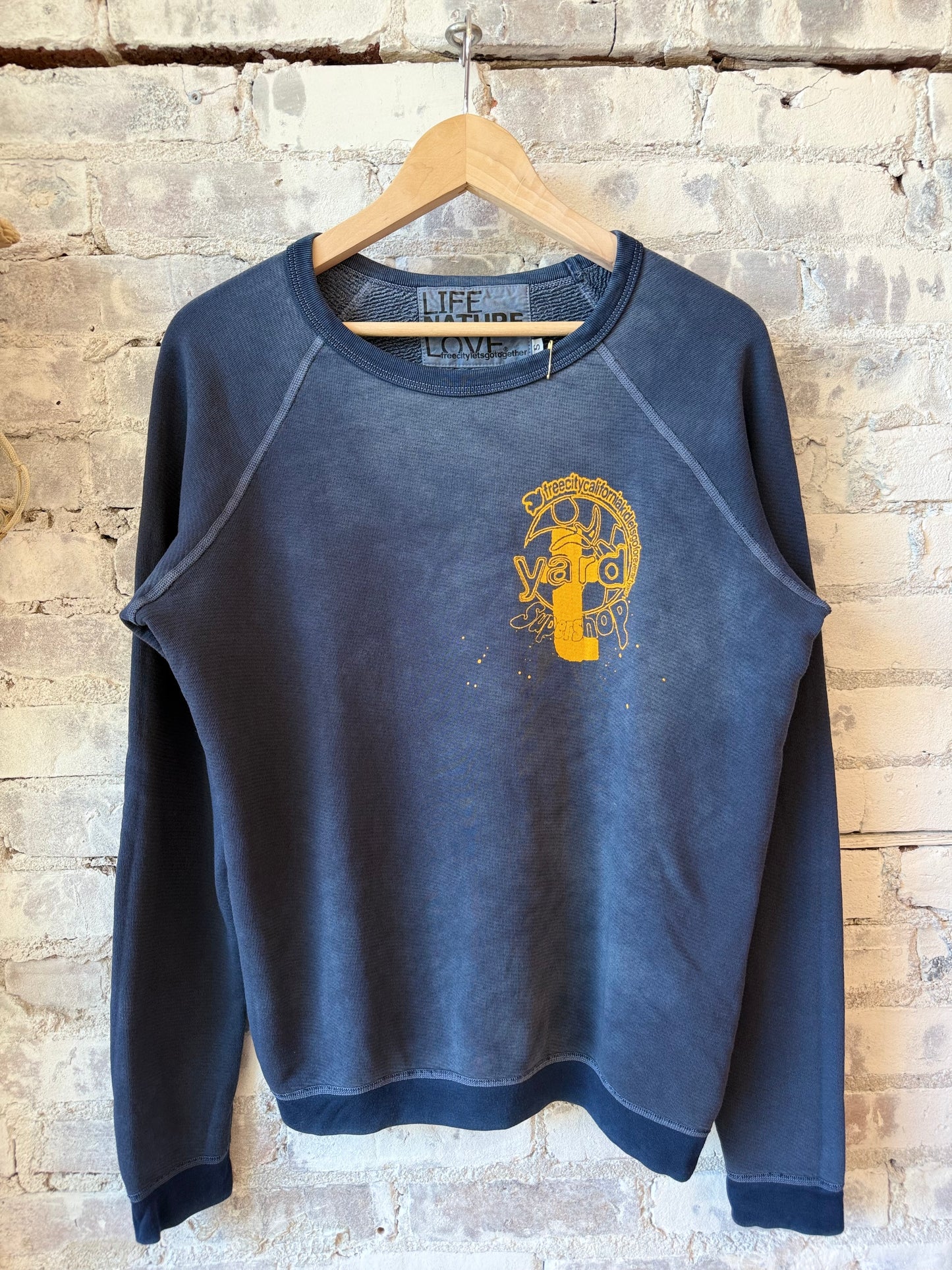 Women's Freecity ARTYARD/SUPERSHOP stamp superyumm raglan with Moonshrooms Powder design, featuring colorful mushroom artwork on the shirt.