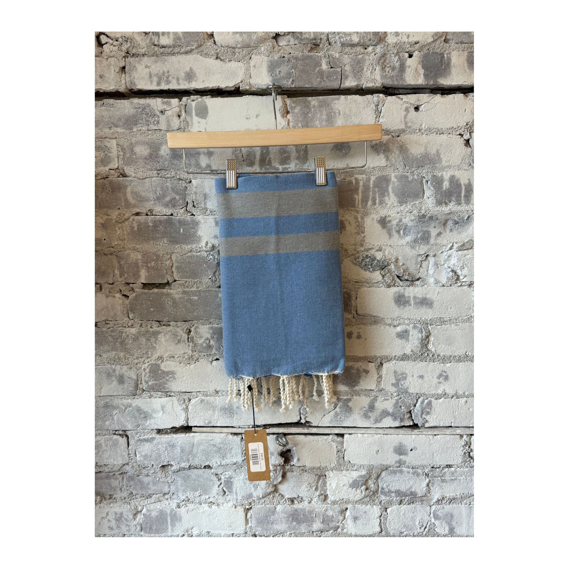 Blue stone Turkish beach towel sarong by Wonderfouta, showcasing soft fabric with intricate patterns and vibrant colors.