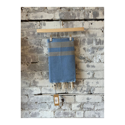 Blue stone Turkish beach towel sarong by Wonderfouta, showcasing soft fabric with intricate patterns and vibrant colors.