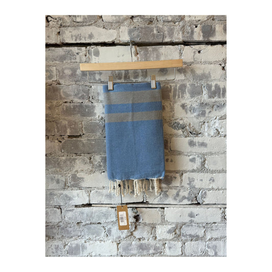 Blue stone Turkish beach towel sarong by Wonderfouta, showcasing soft fabric with intricate patterns and vibrant colors.