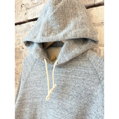 Men's Kepani Manchester 2 gray pullover hoodie, soft fabric, front pocket, casual style, displayed on a hanger.