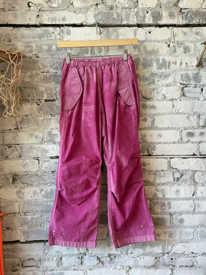 Women's Freecity pink kite pant with poplin fabric, air flap, and snap closure, featuring a stylish pink plant design.