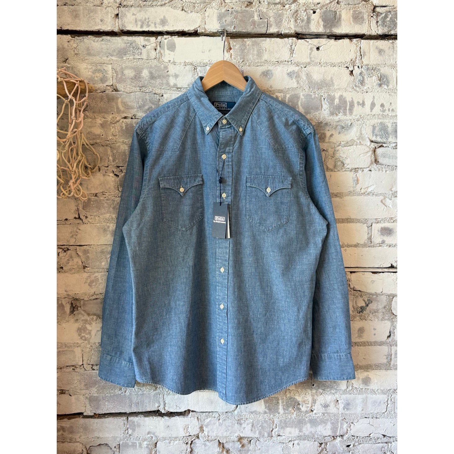 Men's Polo RL chambray classic western sport shirt in medium indigo, showing collar, button front, and western-style yoke details.
