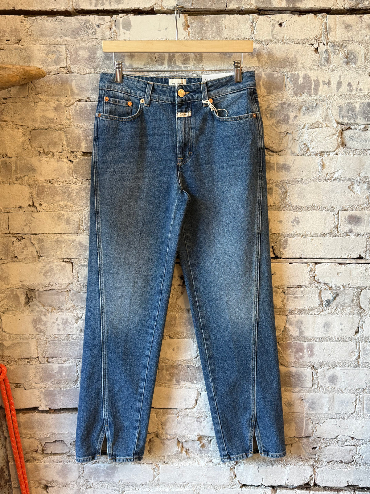 Women's Milo Straight Jean by Closed in mid blue denim, showing the classic fit and clean design with front pockets and belt loops.