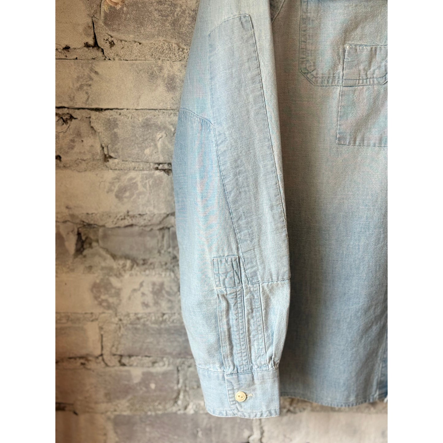 Men's Polo RL chambray compass workshirt in medium indigo, featuring a button-up design and classic workwear style.