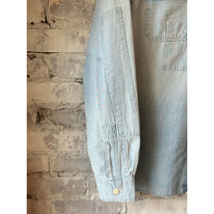 Men's Polo RL chambray compass workshirt in medium indigo, featuring a button-up design and classic workwear style.