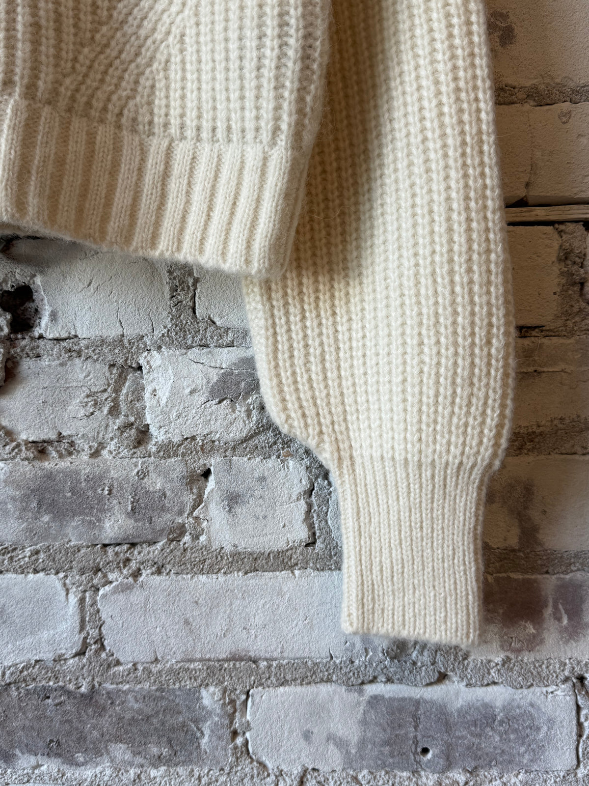 ELEVEN SIX Becca Cardi for women in ivory, showcasing a cozy knit sweater with a relaxed fit and ribbed cuffs.