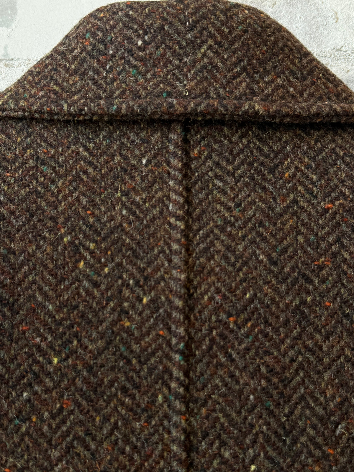 Presidents Hickory Garden Coat, a stylish outdoor coat with a rugged design, shown in a natural outdoor setting.