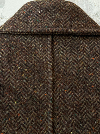 Presidents Hickory Garden Coat, a stylish outdoor coat with a rugged design, shown in a natural outdoor setting.