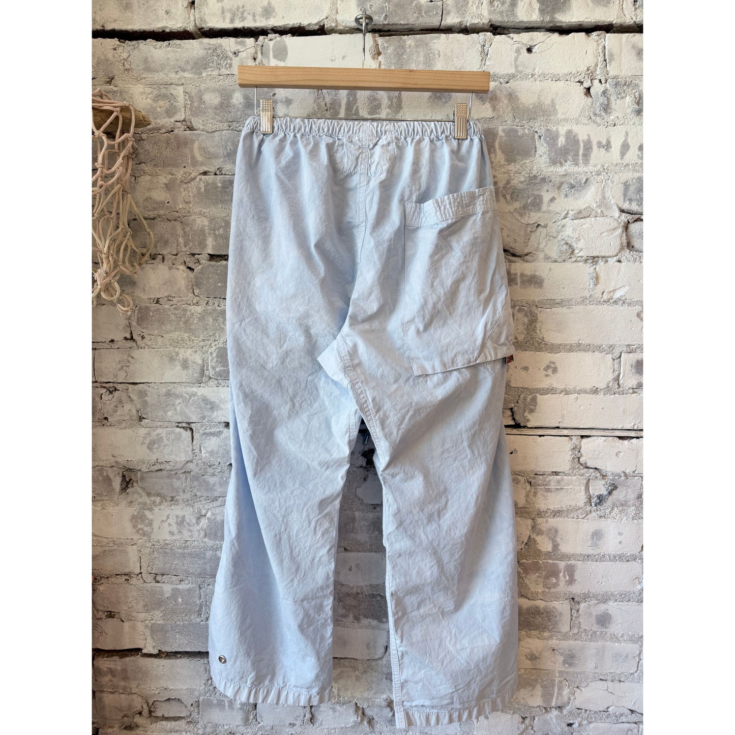 Women's Freecity OUTOFSIGHT poplin kite pant in blue plant with air flap and snap closures, casual and stylish for everyday wear.