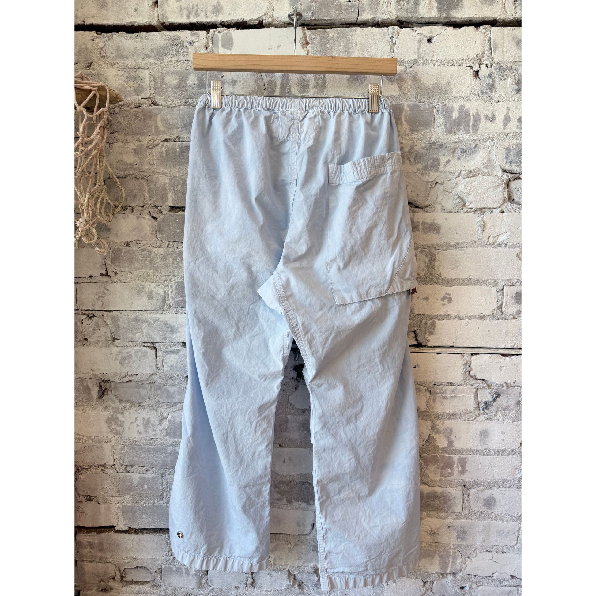 Women's Freecity OUTOFSIGHT poplin kite pant in blue plant with air flap and snap closures, casual and stylish for everyday wear.