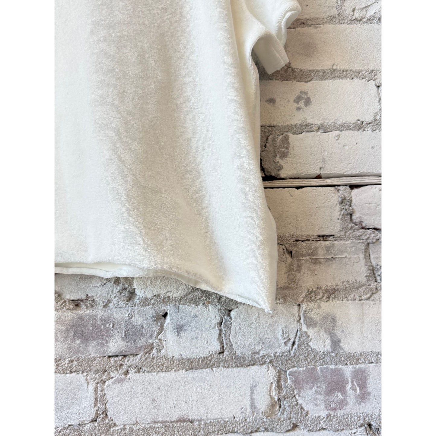Women's organic cotton Terry semi-relaxed crewneck top by Majestic Filatures in milk color, laid flat showing neckline and fabric texture.