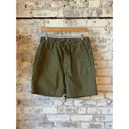 Men's premium olive deck shorts by Freenote Cloth, casual fit with front and back pockets, versatile summer apparel.