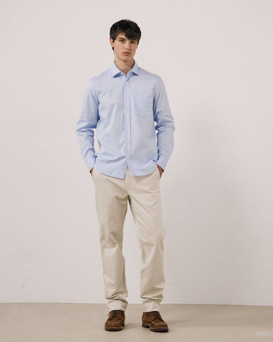 Sky blue Paul woven shirt by Hartford Men's, featuring a classic design and woven fabric, displayed on a hanger.