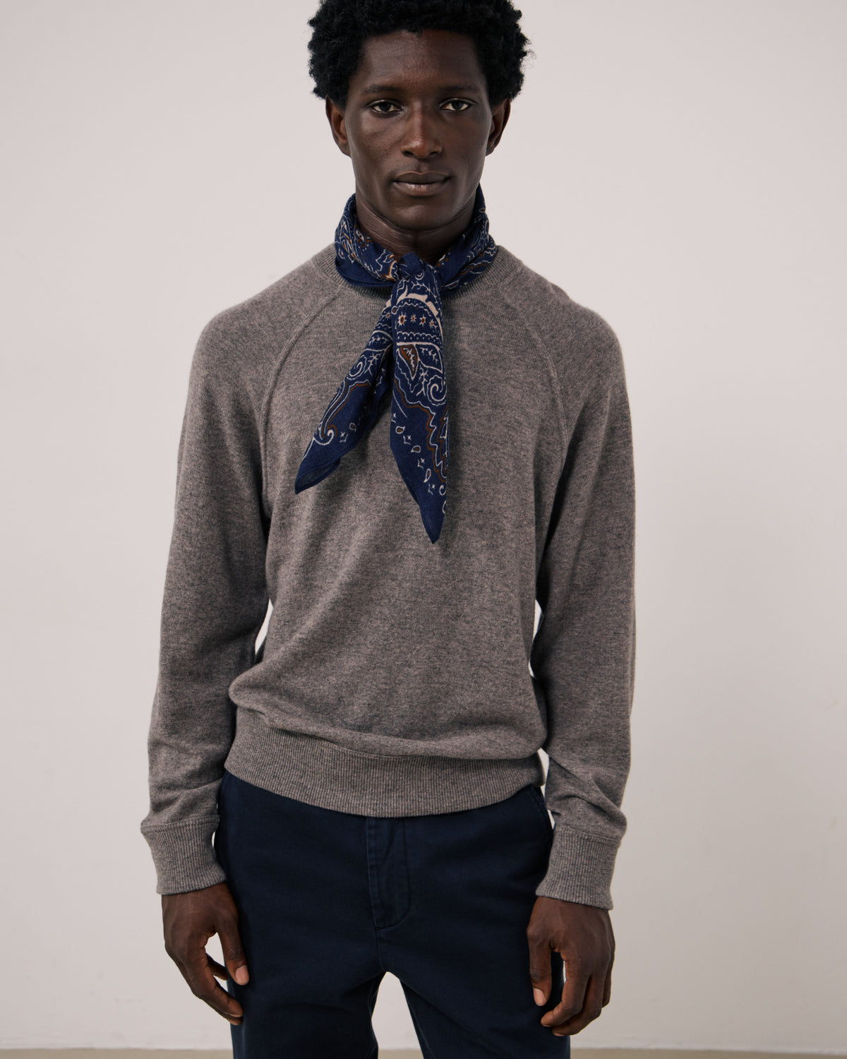 Navy paisley woven scarf by Hartford Men's, featuring detailed pattern and soft fabric, styled as a versatile accessory for men.