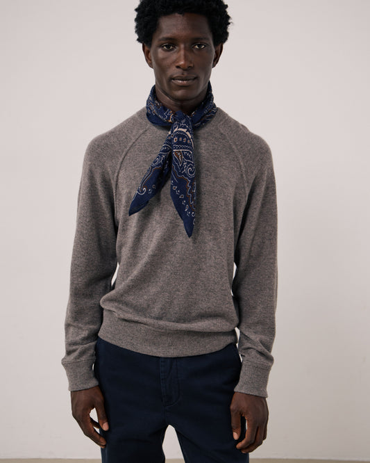 Navy paisley woven scarf by Hartford Men's, featuring detailed pattern and soft fabric, styled as a versatile accessory for men.