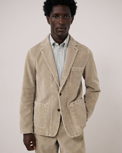 Hartford Men's Julian Woven Jacket in sand color, featuring a textured woven fabric and classic design, displayed on a hanger.