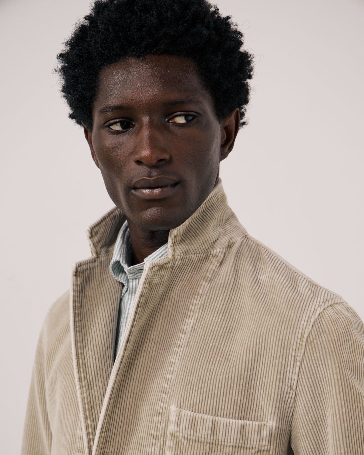 Hartford Men's Julian Woven Jacket in Sand, featuring textured fabric and a casual design, shown on a model.