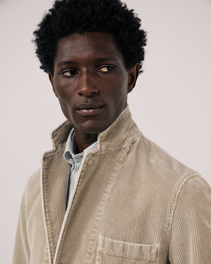 Hartford Men's Julian Woven Jacket in Sand, featuring textured fabric and a casual design, shown on a model.
