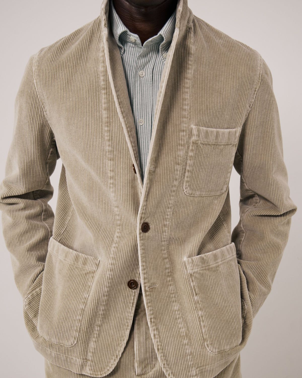 Hartford Men's Julian Woven Jacket in Sand, showing the stylish woven design and tailored fit on a neutral background.