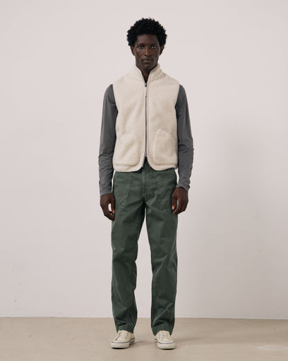 Hartford Men's Basta knitted vest in natural color, shown on a mannequin, featuring a cozy, ribbed knit design and V-neck style.