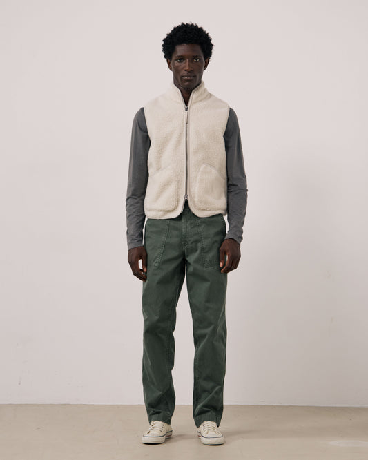Hartford Men's Basta knitted vest in natural color, shown on a mannequin, featuring a cozy, ribbed knit design and V-neck style.
