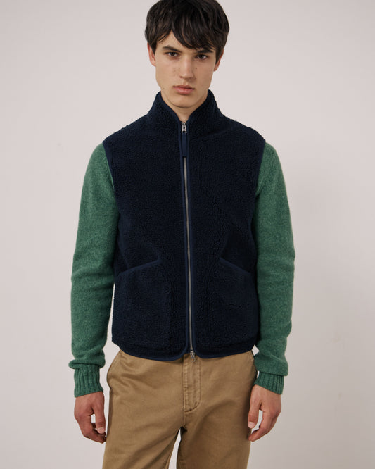 Hartford Men's navy knitted vest, Basta style, featuring a cozy, textured knit pattern and ribbed neckline.