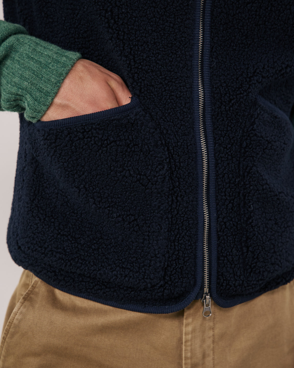 Hartford Men's navy knitted vest with ribbed neckline and hem, styled for a comfortable, classic look.