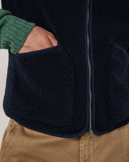 Hartford Men's navy knitted vest with ribbed neckline and hem, styled for a comfortable, classic look.