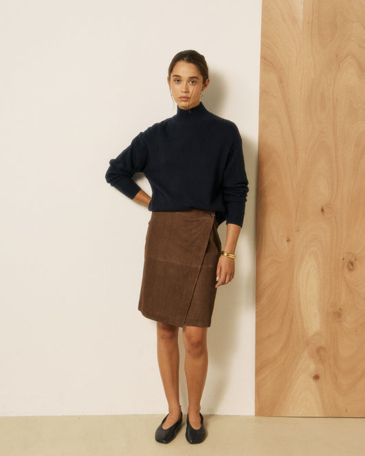 Navy Hartford Women's Mylo knitted sweater, cozy and stylish, shown on a model with a textured knit pattern.